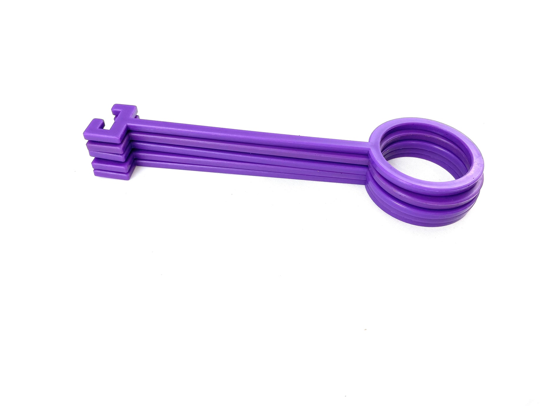 The Yankee Thunder Purple Clay Pigeon Hooks is a purple plastic tool featuring a large circular handle and three long, flat prongs designed for opening or loosening objects. Made from durable polymer, it lies horizontally against a white background, providing longevity and strength for various tasks.